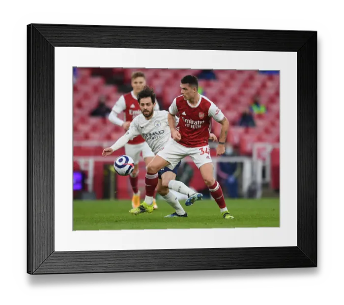 Framed Print : Clash of Titans: Arsenal's Xhaka vs Man City's Gundogan - Premier League Showdown, London 2021 Framed Print : Clash of Titans: Arsenal's Xhaka vs Man City's Gundogan - Premier League Showdown, London 2021