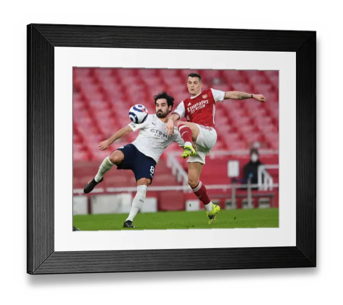 Framed Print : Clash of Titans: Arsenal vs Manchester City - Granit Xhaka vs Ilkay Gundogan in Empty Emirates Stadium Framed Print : Clash of Titans: Arsenal vs Manchester City - Granit Xhaka vs Ilkay Gundogan in Empty Emirates Stadium