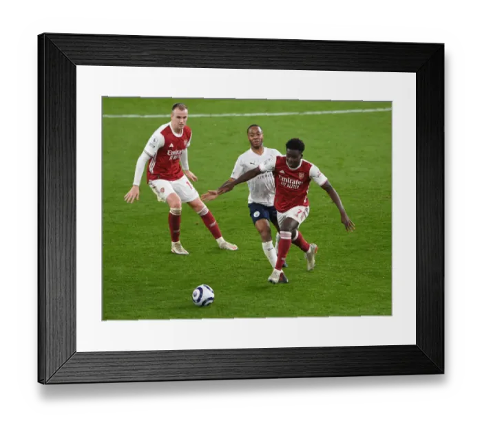 Framed Print : Arsenal vs Manchester City: Bukayo Saka vs Raheem Sterling Clash in Empty Emirates Stadium, Premier League 2020-21