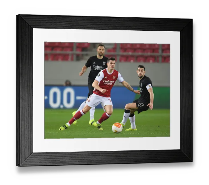 Framed Print : Arsenal's Granit Xhaka Clashes with Benfica's Pizzi in Europa League Showdown Framed Print : Arsenal's Granit Xhaka Clashes with Benfica's Pizzi in Europa League Showdown