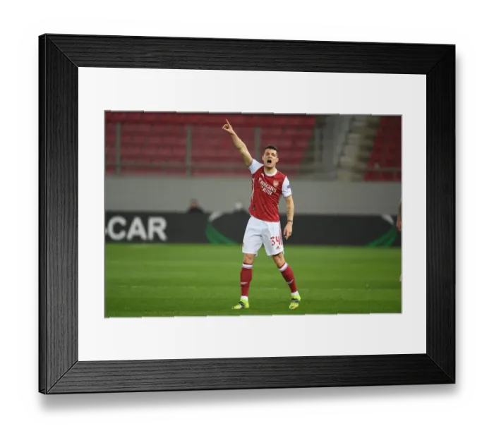 Framed Print : Arsenal's Granit Xhaka in Action Against SL Benfica in UEFA Europa League Round of 32 Framed Print : Arsenal's Granit Xhaka in Action Against SL Benfica in UEFA Europa League Round of 32