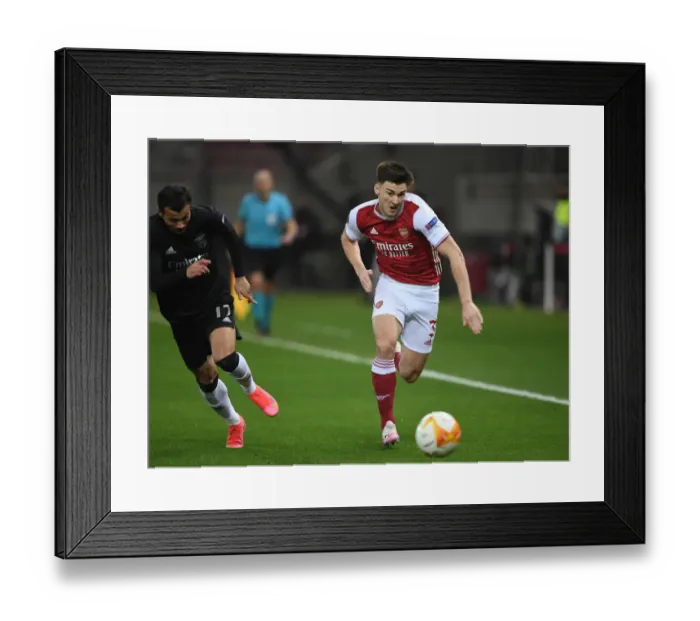 Framed Print : Arsenal's Kieran Tierney Outmaneuvers Benfica's Diogo Goncalves in Europa League Clash