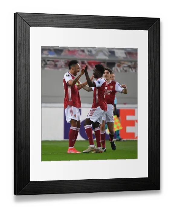 Framed Print : Arsenal's Aubameyang and Saka: Celebrating Goal in Europa League Victory over SL Benfica Framed Print : Arsenal's Aubameyang and Saka: Celebrating Goal in Europa League Victory over SL Benfica