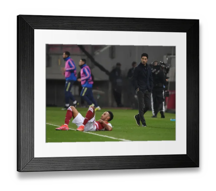 Framed Print : Mikel Arteta Watches as Aubameyang Faces Foul in Arsenal's Europa League Clash vs SL Benfica Framed Print : Mikel Arteta Watches as Aubameyang Faces Foul in Arsenal's Europa League Clash vs SL Benfica
