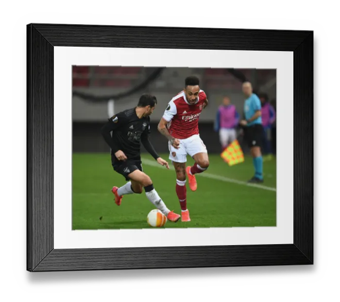 Framed Print : Arsenal's Aubameyang Clashes with Benfica's Goncalves in Europa League Showdown