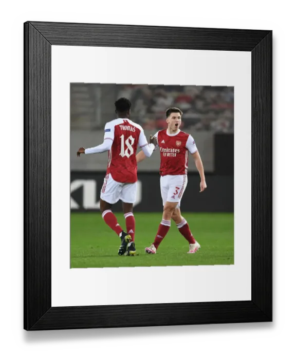 Framed Print : Arsenal's Kieran Tierney and Thomas Partey Celebrate Goals Against SL Benfica in Europa League