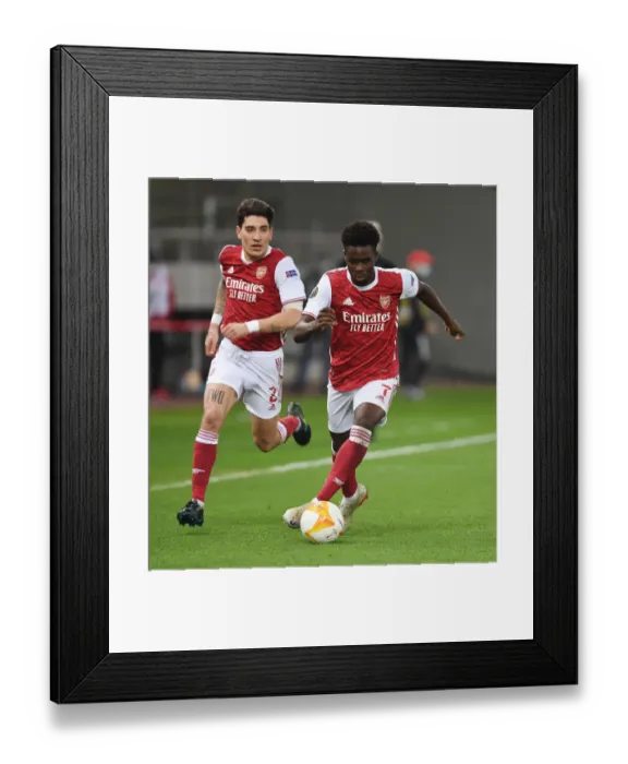 Framed Print : Arsenal's Bellerin and Saka in Action against SL Benfica in Europa League Round of 32 Framed Print : Arsenal's Bellerin and Saka in Action against SL Benfica in Europa League Round of 32