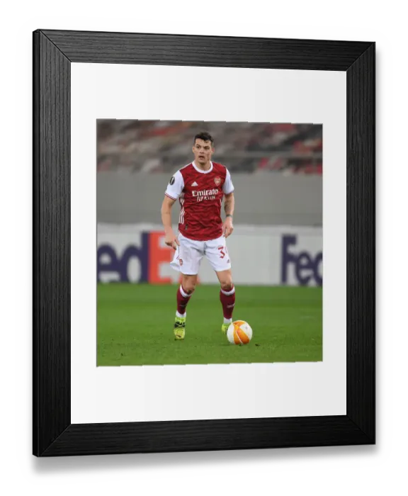 Framed Print : Granit Xhaka: Arsenal's Europa League Battle against SL Benfica Framed Print : Granit Xhaka: Arsenal's Europa League Battle against SL Benfica