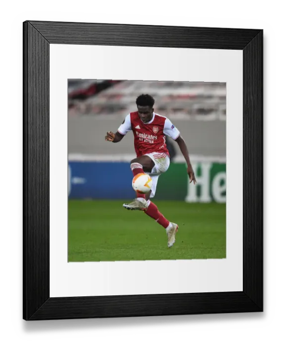 Framed Print : Arsenal's Bukayo Saka in Action during Arsenal vs SL Benfica Europa League Clash (February 2021, Piraeus, Greece) Framed Print : Arsenal's Bukayo Saka in Action during Arsenal vs SL Benfica Europa League Clash (February 2021, Piraeus, Greece)