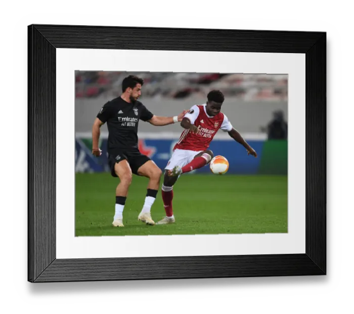 Framed Print : Arsenal's Bukayo Saka Clashes with Gabriel in Europa League Showdown vs SL Benfica