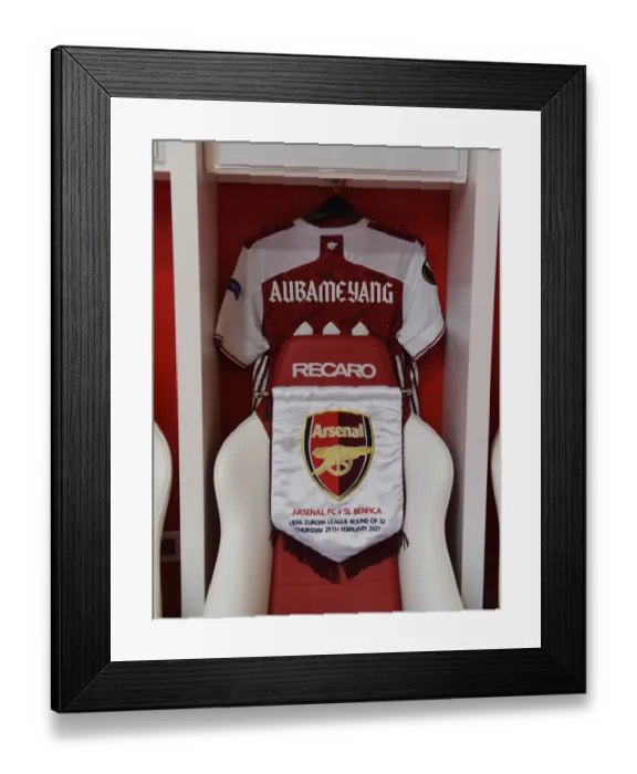 Framed Print : Arsenal FC: Aubameyang's Shirt and Pennant in the Changing Room Before Arsenal v SL Benfica, UEFA Europa League Round of 32 (Piraeus, Greece - February 25, 2021) Framed Print : Arsenal FC: Aubameyang's Shirt and Pennant in the Changing Room Before Arsenal v SL Benfica, UEFA Europa League Round of 32 (Piraeus, Greece - February 25, 2021)