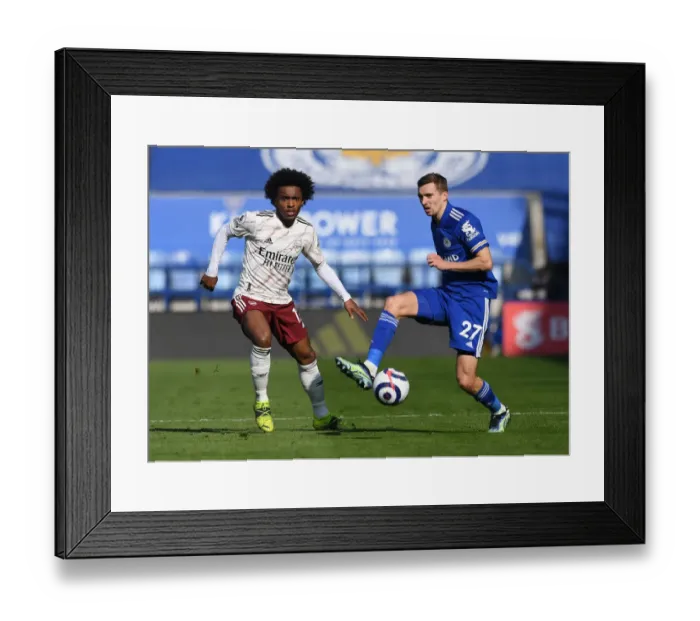 Framed Print : Willian vs. Castagne: Intense Battle in Leicester City vs. Arsenal Premier League Clash Framed Print : Willian vs. Castagne: Intense Battle in Leicester City vs. Arsenal Premier League Clash