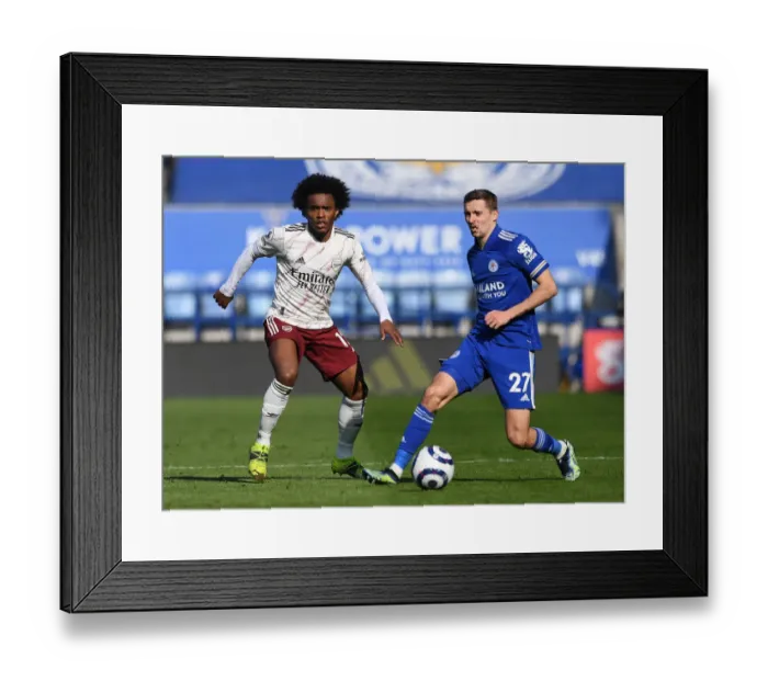 Framed Print : Willian vs. Castagne: A Football Showdown at The King Power Stadium