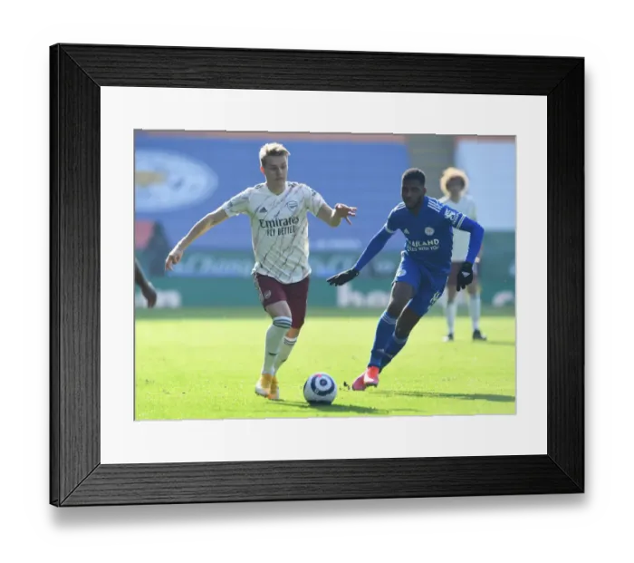 Framed Print : Odegaard vs. Iheanacho: A Premier League Battle at The King Power Stadium Framed Print : Odegaard vs. Iheanacho: A Premier League Battle at The King Power Stadium