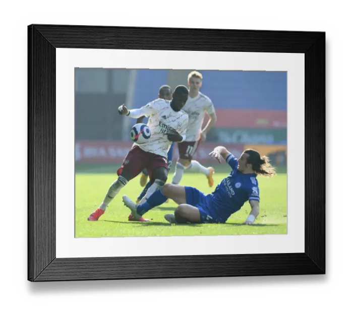 Framed Print : Pepe vs Soyuncu: Intense Battle in Leicester City vs Arsenal Premier League Clash