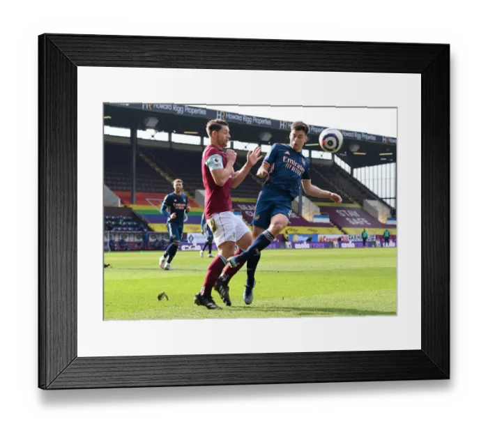 Framed Print : Burnley vs Arsenal: Tierney vs Tarkowski in Empty Turf Moor, Premier League Clash Amidst Pandemic