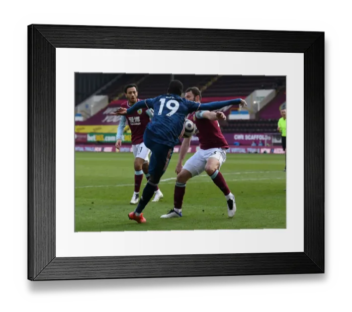 Framed Print : Burnley vs. Arsenal: Pepe Faces Pieters in Empty Turf Moor (2020-21)