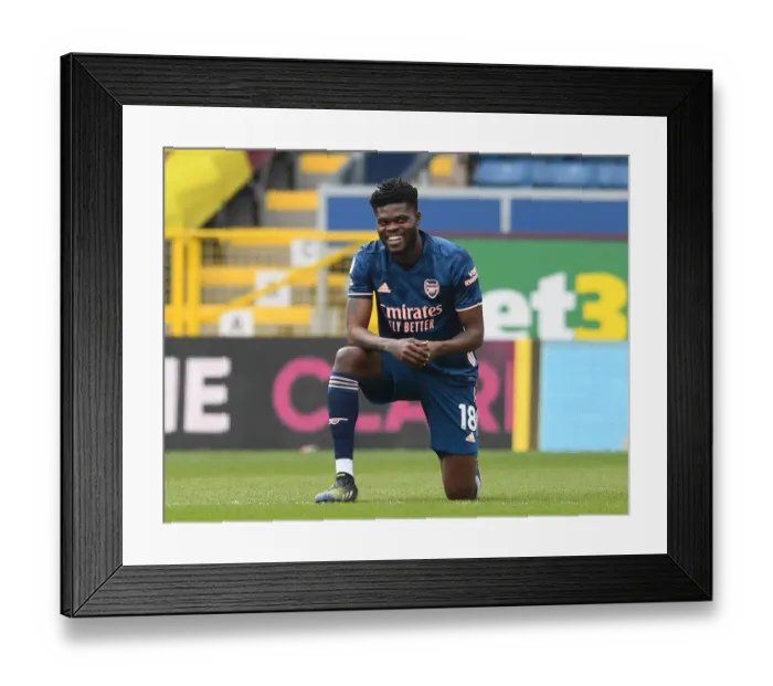Framed Print : Thomas Partey Kneels: Burnley vs. Arsenal, Empty Turf Moor - Premier League 2020-21 Framed Print : Thomas Partey Kneels: Burnley vs. Arsenal, Empty Turf Moor - Premier League 2020-21