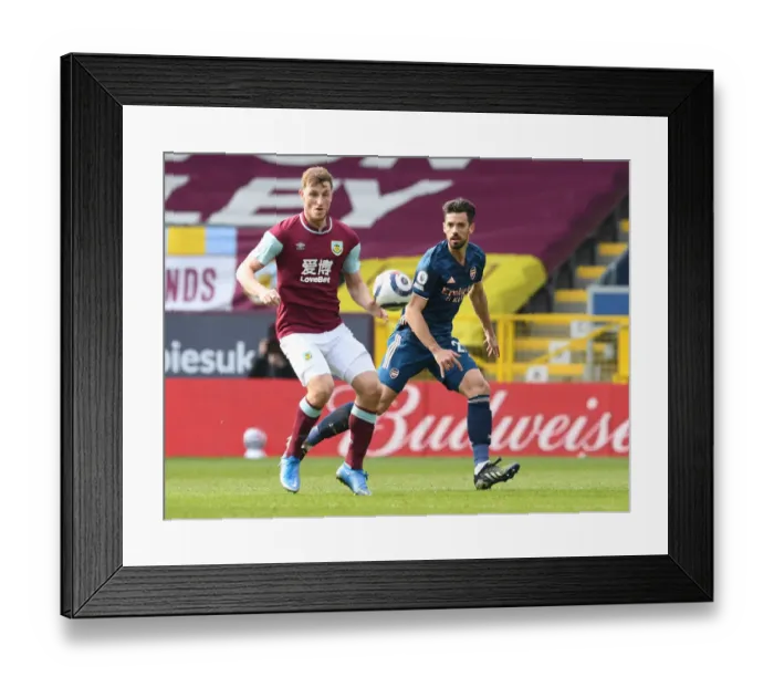 Framed Print : Burnley vs Arsenal: Pablo Mari Closes In on Chris Wood Amid Empty Premier League Stands (March 2021) Framed Print : Burnley vs Arsenal: Pablo Mari Closes In on Chris Wood Amid Empty Premier League Stands (March 2021)