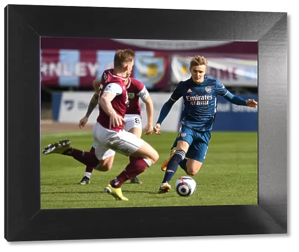 Burnley vs. Arsenal: Martin Odegaard Faces Off Against Charlie Taylor Amidst Empty Turf Moor