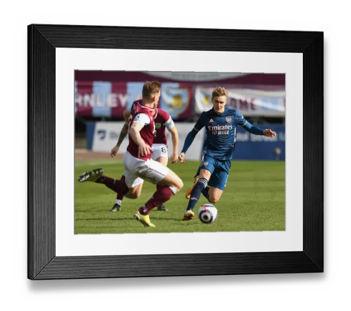 Framed Print : Burnley vs. Arsenal: Martin Odegaard Faces Off Against Charlie Taylor Amidst Empty Turf Moor Framed Print : Burnley vs. Arsenal: Martin Odegaard Faces Off Against Charlie Taylor Amidst Empty Turf Moor
