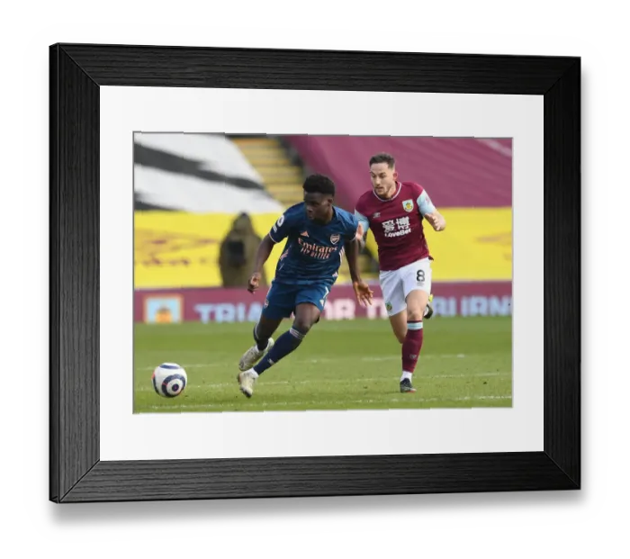 Framed Print : Burnley vs Arsenal: Saka Takes on Brownhill in Empty Turf Moor, Premier League 2020-21