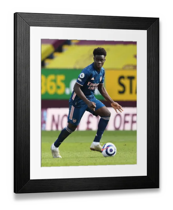 Framed Print : Bukayo Saka Shines in Empty Turf Moor: Arsenal vs. Burnley, Premier League 2021 Framed Print : Bukayo Saka Shines in Empty Turf Moor: Arsenal vs. Burnley, Premier League 2021