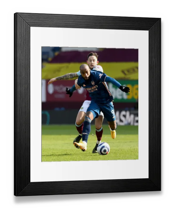 Framed Print : Burnley vs. Arsenal: Lacazette vs. Brownhill - A Head-to-Head Battle in Empty Turf Moor, Premier League (2020-21) Framed Print : Burnley vs. Arsenal: Lacazette vs. Brownhill - A Head-to-Head Battle in Empty Turf Moor, Premier League (2020-21)