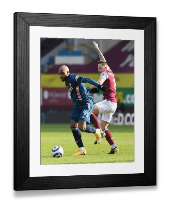 Framed Print : Burnley vs Arsenal: Lacazette Faces Brownhill in Empty Turf Moor, Premier League 2021 Framed Print : Burnley vs Arsenal: Lacazette Faces Brownhill in Empty Turf Moor, Premier League 2021