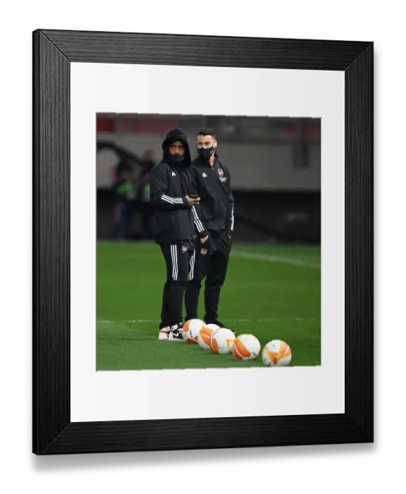 Framed Print : Arsenal's Lacazette and Martinelli Prepare for Olympiacos Showdown in Empty Europa League Stadium Framed Print : Arsenal's Lacazette and Martinelli Prepare for Olympiacos Showdown in Empty Europa League Stadium