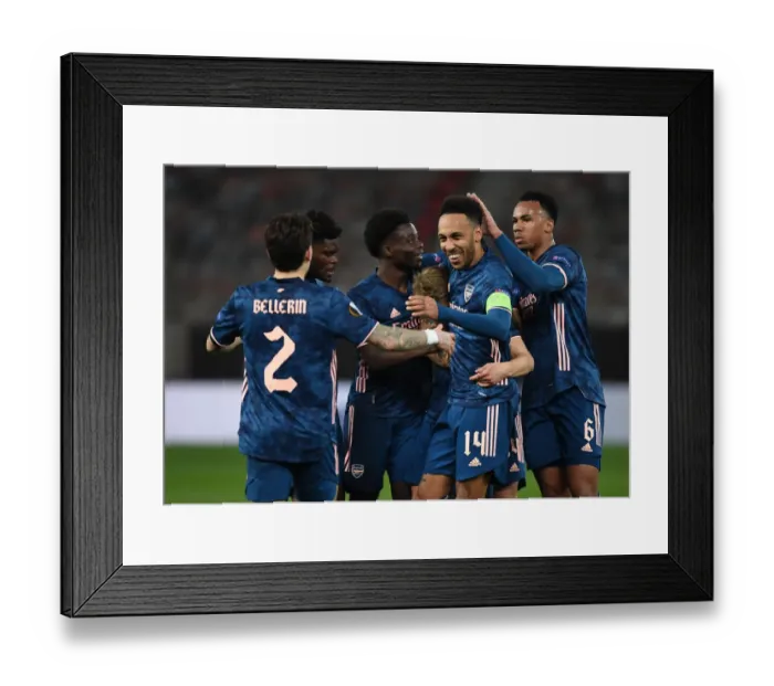 Framed Print : Arsenal Celebrate First Goal Against Olympiacos in Empty Karaiskakis Stadium, UEFA Europa League Round of 16
