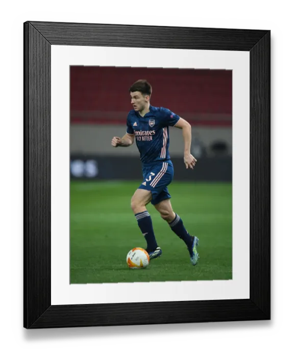 Framed Print : Arsenal's Kieran Tierney in Empty Europa League Action: Olympiacos vs. Arsenal (2021)