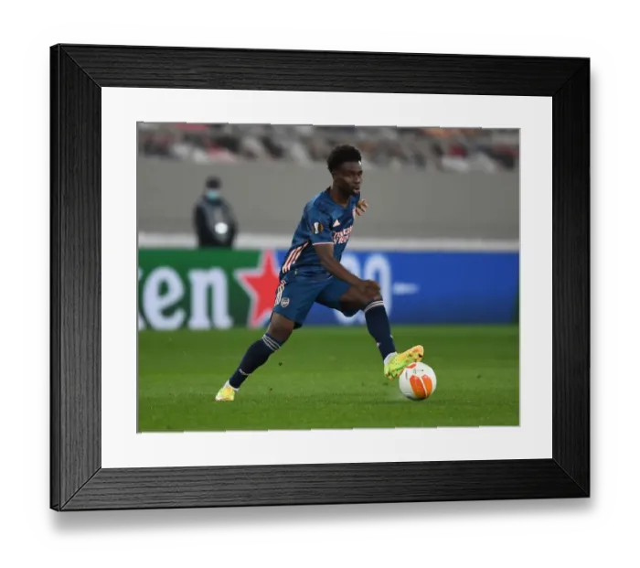 Framed Print : Arsenal's Bukayo Saka in Action at Empty Karaiskakis Stadium: Olympiacos vs. Arsenal, UEFA Europa League Round of 16 (March 2021) Framed Print : Arsenal's Bukayo Saka in Action at Empty Karaiskakis Stadium: Olympiacos vs. Arsenal, UEFA Europa League Round of 16 (March 2021)
