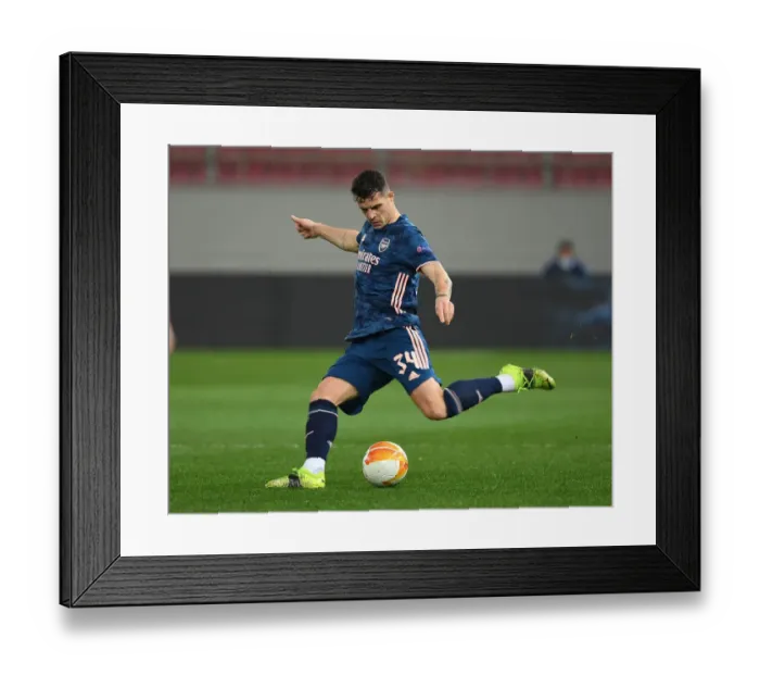 Framed Print : Granit Xhaka in UEFA Europa League: Olympiacos vs. Arsenal - Behind Closed Doors