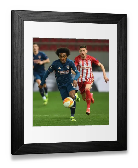 Framed Print : Arsenal's Willian Scores Past Olympiacos in Empty Europa League Stadium