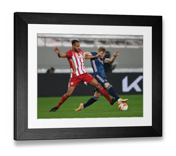 Framed Print : Odegaard vs El Arabi: Empty Karaiskakis Stadium Showdown - Arsenal's Europa League Battle with Olympiacos (March 2021)