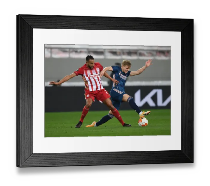 Framed Print : Odegaard vs El Arabi: A Battle in Empty Karaiskakis Stadium - Olympiacos vs Arsenal, UEFA Europa League Round of 16 Framed Print : Odegaard vs El Arabi: A Battle in Empty Karaiskakis Stadium - Olympiacos vs Arsenal, UEFA Europa League Round of 16