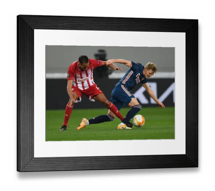 Framed Print : Empty Karaiskakis Stadium Showdown: Odegaard vs El Arabi - Arsenal's Europa League Battle with Olympiacos (March 2021) Framed Print : Empty Karaiskakis Stadium Showdown: Odegaard vs El Arabi - Arsenal's Europa League Battle with Olympiacos (March 2021)