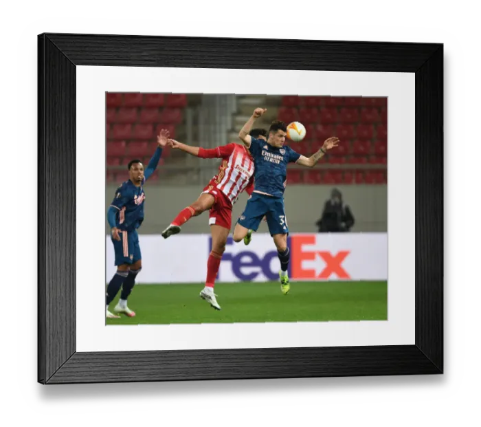Framed Print : Granit Xhaka vs Youssef El Arabi: Olympiacos vs Arsenal in Empty Karaiskakis Stadium, UEFA Europa League Round of 16 Framed Print : Granit Xhaka vs Youssef El Arabi: Olympiacos vs Arsenal in Empty Karaiskakis Stadium, UEFA Europa League Round of 16