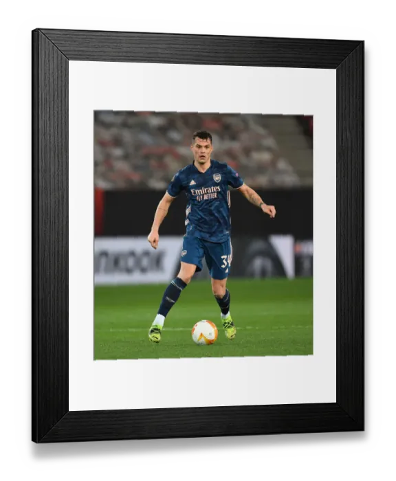 Framed Print : Arsenal's Granit Xhaka in UEFA Europa League Action Against Olympiacos in Empty Karaiskakis Stadium