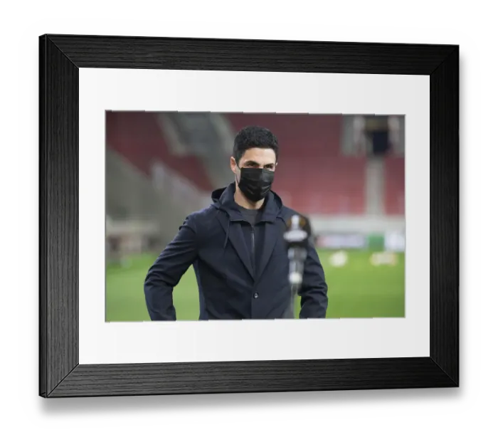 Framed Print : Arsenal's Europa League Clash with Olympiacos: Mikel Arteta Holds Pre-Match Conference Amidst Empty Stands in Piraeus