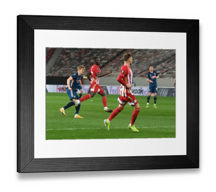 Framed Print : Martin Odegaard Scores in Empty Karaiskakis Stadium: Arsenal's Europa League Triumph Amidst Pandemic (March 11, 2021) Framed Print : Martin Odegaard Scores in Empty Karaiskakis Stadium: Arsenal's Europa League Triumph Amidst Pandemic (March 11, 2021)