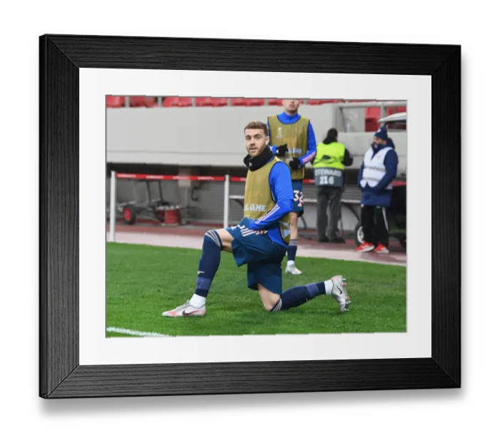 Framed Print : Arsenal's Calum Chambers in UEFA Europa League Action against Olympiacos in Empty Karaiskakis Stadium