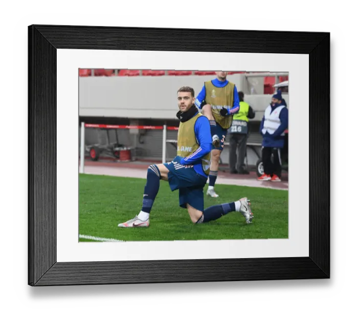 Framed Print : Arsenal's Calum Chambers in Europa League Action against Olympiacos in Greece Amidst Empty Stands (Olympiacos v Arsenal 2021)