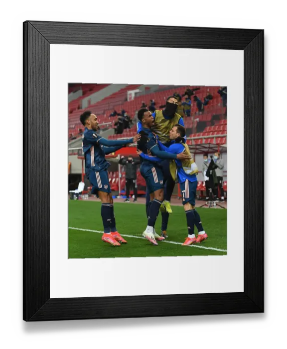 Framed Print : Arsenal's Gabriel Scores in Europa League Win Over Olympiacos Amidst Empty Stands