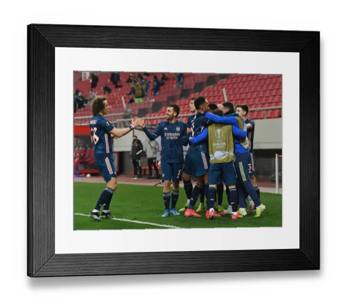 Framed Print : Arsenal Celebrates Double Lead Over Olympiacos in Europa League: Luiz and Ceballos Score in Empty Karaiskakis Stadium
