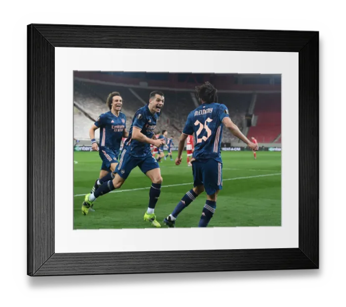 Framed Print : Arsenal's Elneny and Xhaka Celebrate Goals in Empty Karaiskakis Stadium during Olympiacos Clash in Europa League Framed Print : Arsenal's Elneny and Xhaka Celebrate Goals in Empty Karaiskakis Stadium during Olympiacos Clash in Europa League
