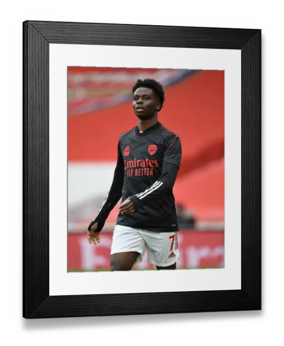 Framed Print : Bukayo Saka Gears Up for Arsenal vs. Tottenham at Empty Emirates Stadium
