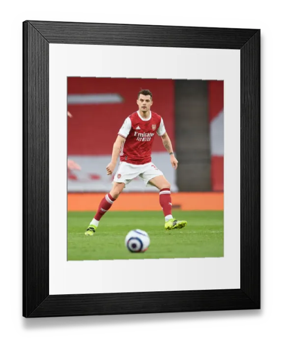 Framed Print : Arsenal's Xhaka Shines in Empty Emirates Derby Against Tottenham