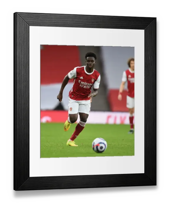 Framed Print : Arsenal's Bukayo Saka in Action Against Tottenham in Empty Emirates Stadium, Premier League 2020-21
